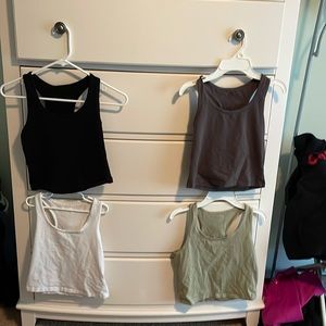 Black, grey, white, and green cropped tank tops from Amazon size small